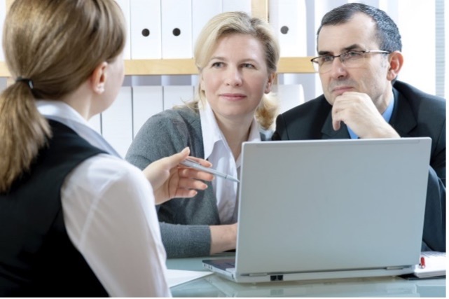 people talking with laptop